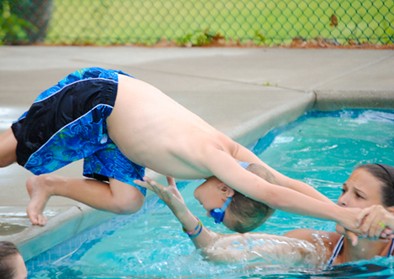 boy-diving-counselor